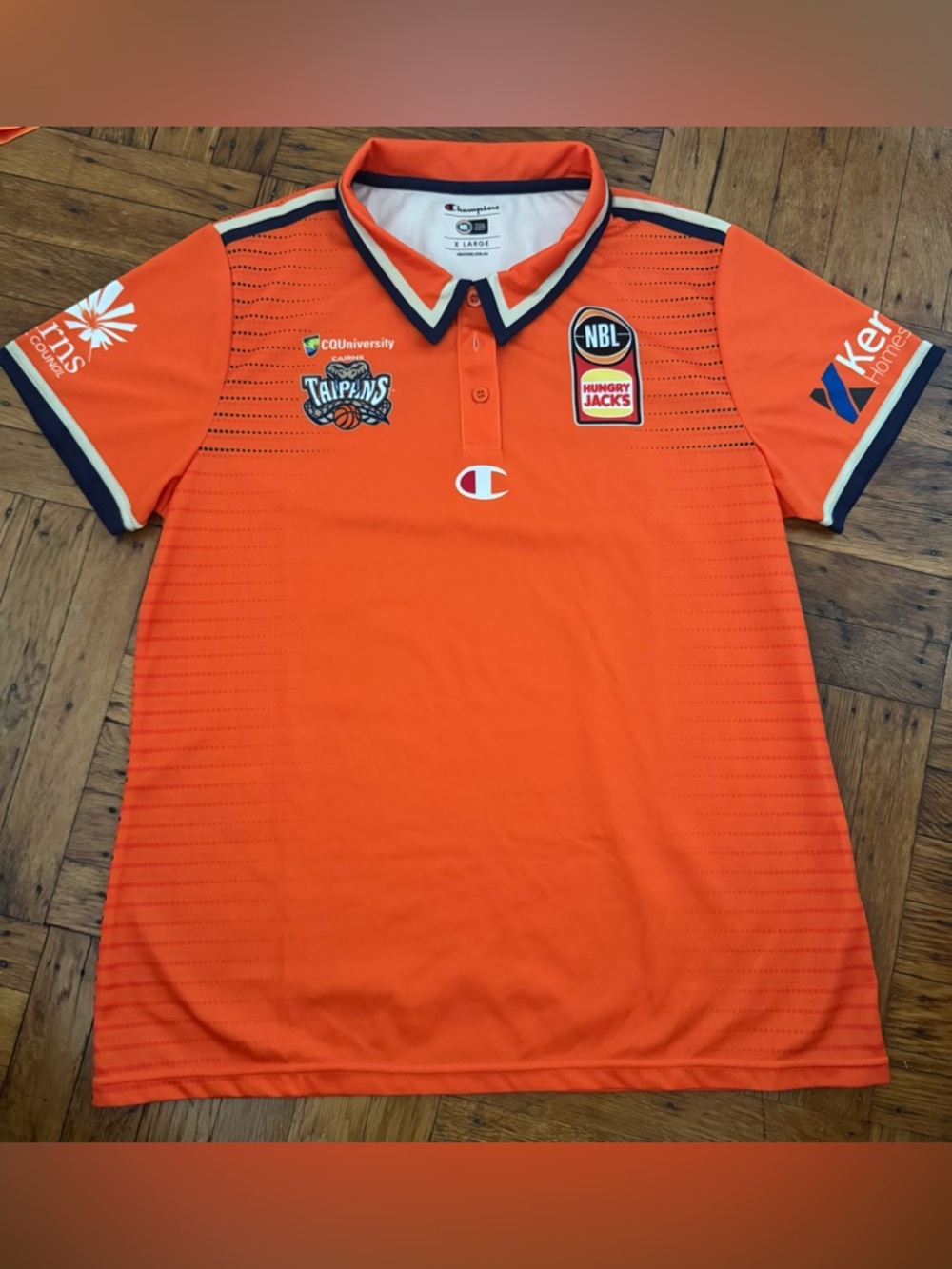 Champion Orange NBL Basketball Tiapans Jersey with NBL and Hungry Jack's Logos